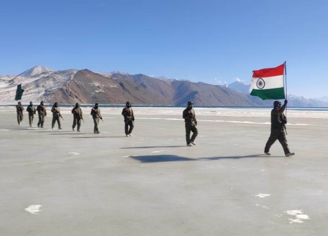 National flag on the frozen water body at 17,000 feet